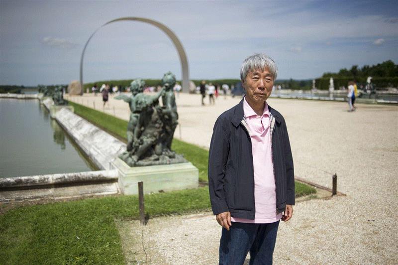 李禹焕于凡尔赛宫展览前，2014年6月11日。图片版权： Fred Dufour、Getty Ima